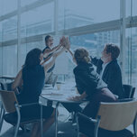 Happy people high-five each other in a meeting